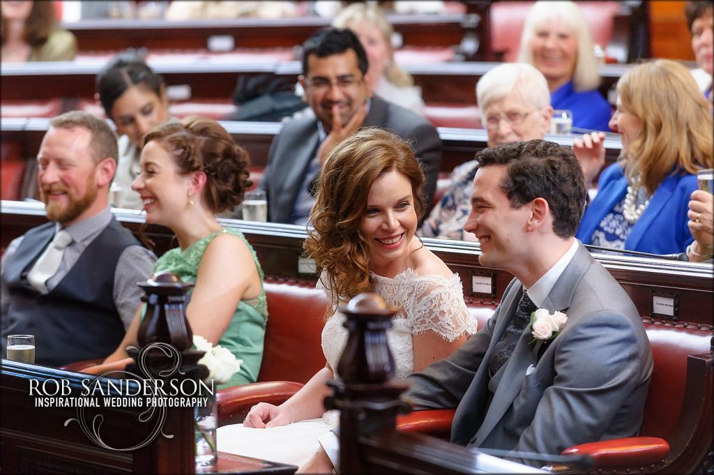 Liverpool Town Hall bride laughing at speeches with new husband