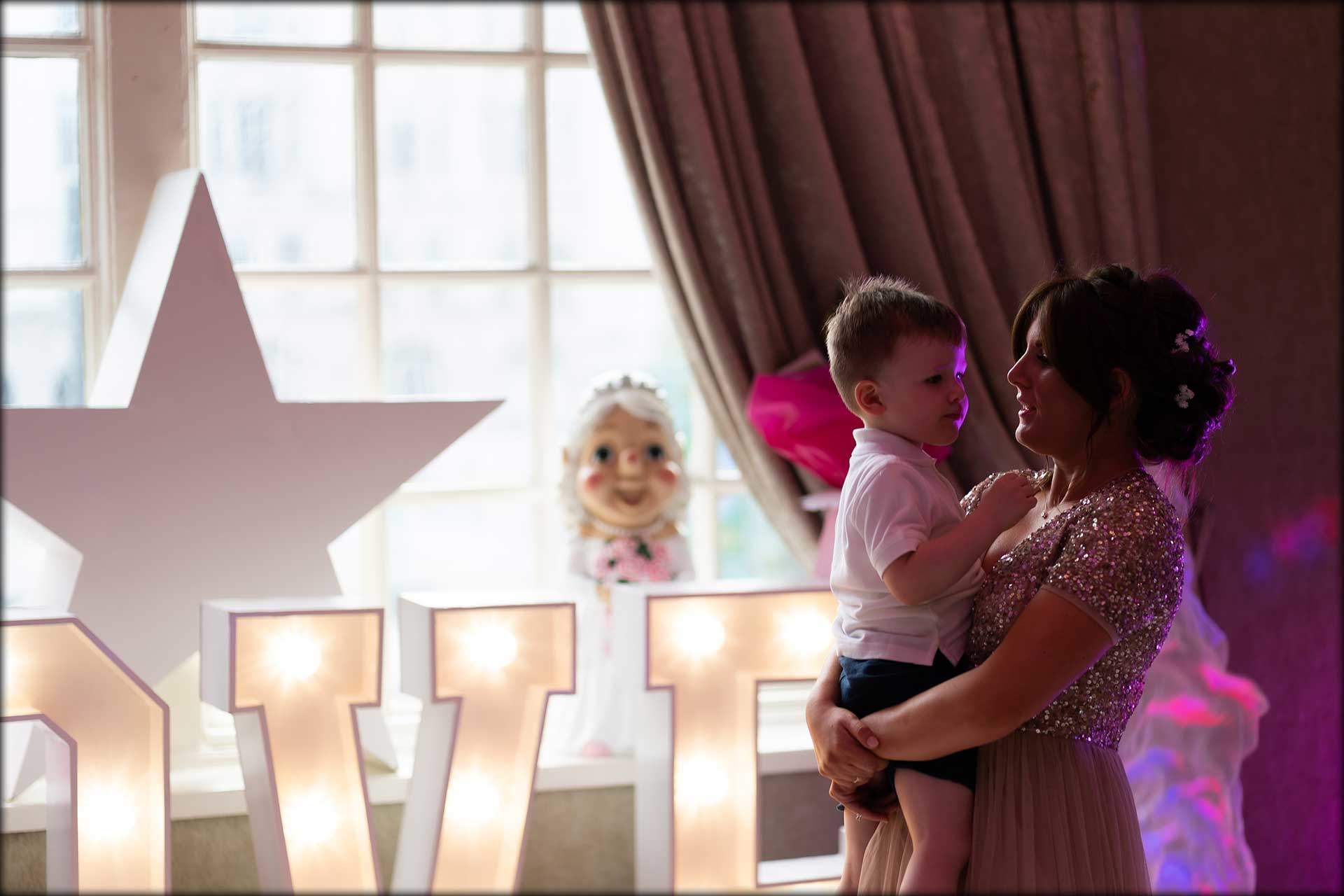 lovely moment between bridesmaid and her son